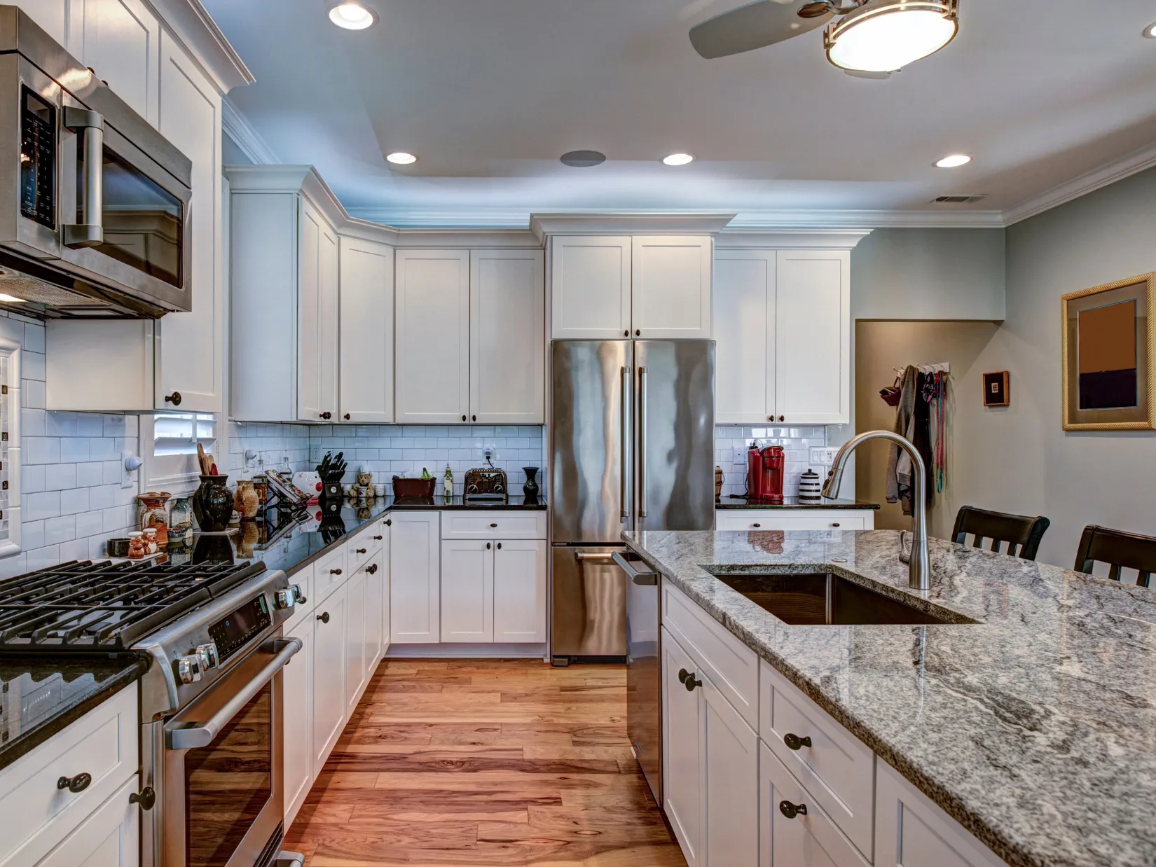 Luxury quartz countertop installation in Dallas TX showcasing expert stone fabrication, seamless edges, and premium white cabinetry in a modern kitchen.