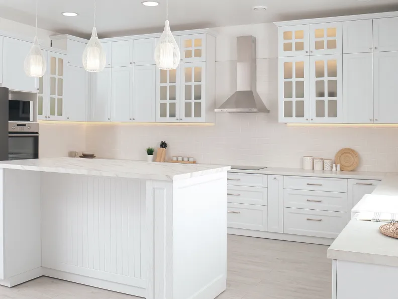 Custom kitchen cabinets installation in Dallas TX featuring white shaker cabinets, modern island, and premium finishes