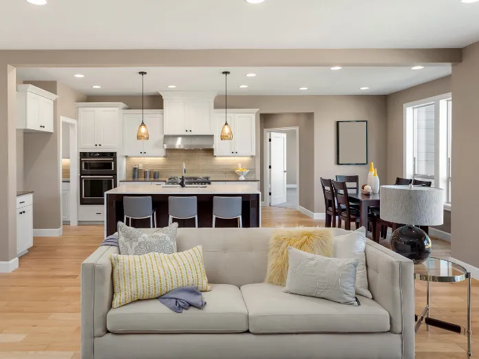 Open concept design and space reconfiguration creating a seamless kitchen and living room layout in Dallas, TX